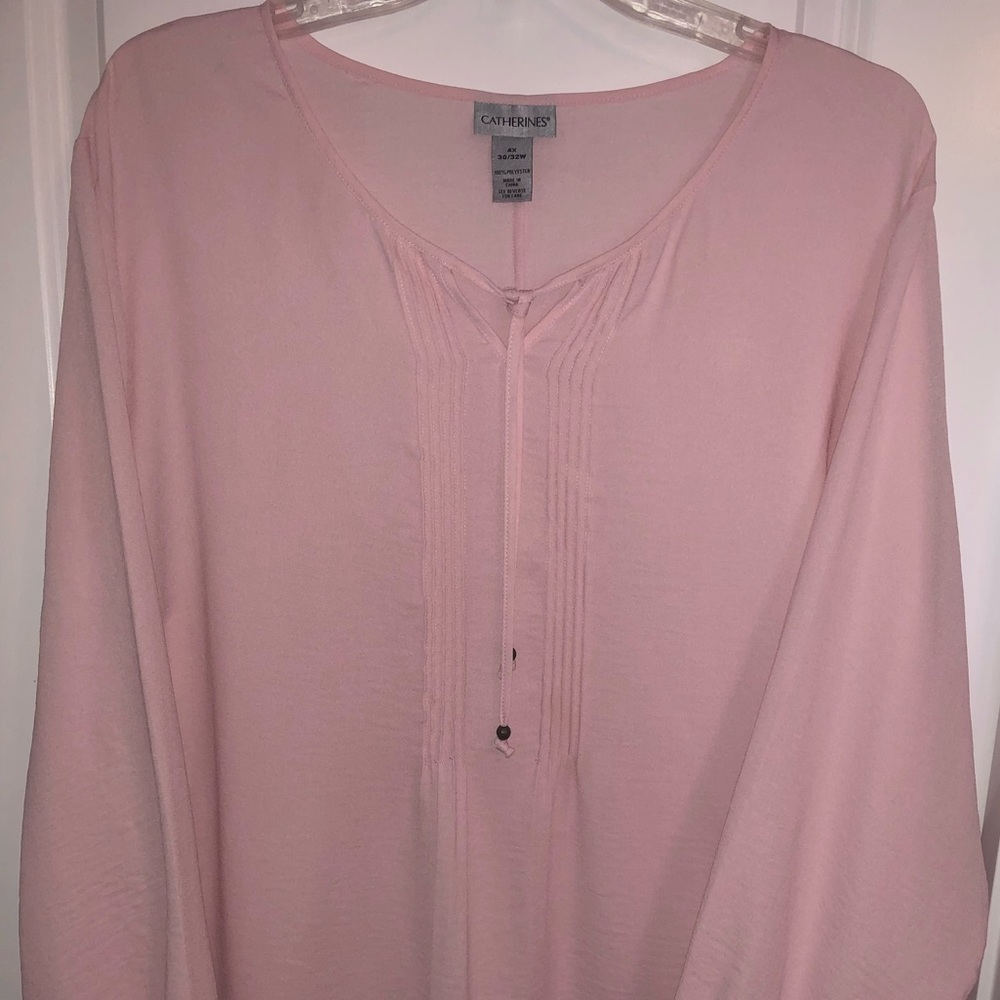 Catherine’s pink blouse